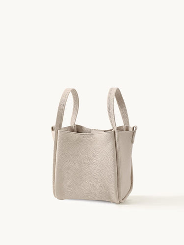Medium Song Bag in Ivory pebble-grain leather with short handles.