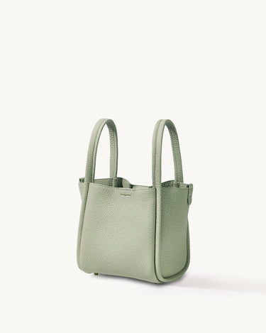 Medium Song Bag in jade green textured leather with dual top handles and subtle embossed logo.
