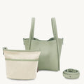 Medium Song Bag in jade green full-grain leather, shown with an interior pouch and a rolled strap.