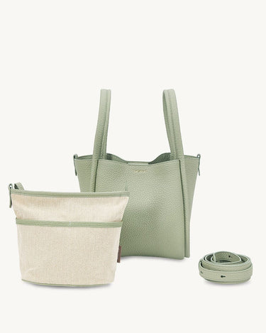 Medium Song Bag in jade green full-grain leather, shown with an interior pouch and a rolled strap.