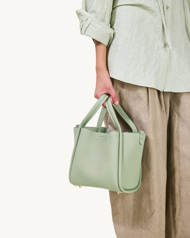 Medium Song Bag in Jade, crafted from textured full-grain leather with a single compartment and magnetic closure.