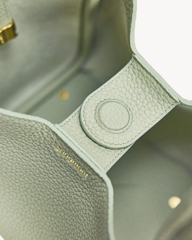 Close-up of Medium Song Bag in Jade, featuring textured full-grain leather and subtle "songmont" gold lettering.