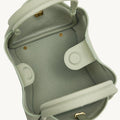 Overhead view of the open Medium Song Bag in Jade, showcasing its full-grain leather interior and structured design.