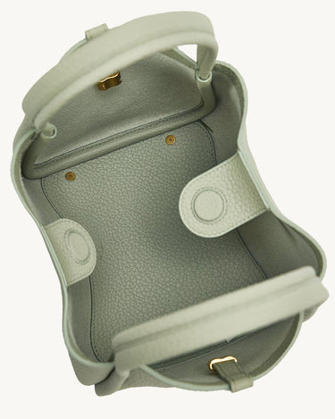 Overhead view of the open Medium Song Bag in Jade, showcasing its full-grain leather interior and structured design.