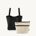 Medium Song Bag in Onyx black textured leather with removable cream fabric inner pouch.