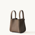Medium Song Bag in taupe full-grain leather with textured finish and two top handles