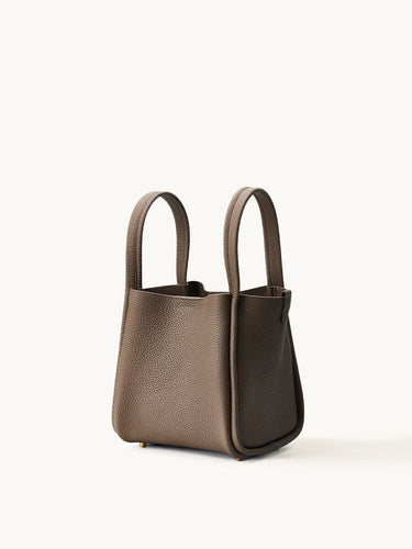 Medium Song Bag in taupe full-grain leather with textured finish and two top handles