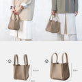 Medium Song Bag in taupe leather, size comparison of small (16.5x12x16cm) and medium (20x17x19cm) sizes.