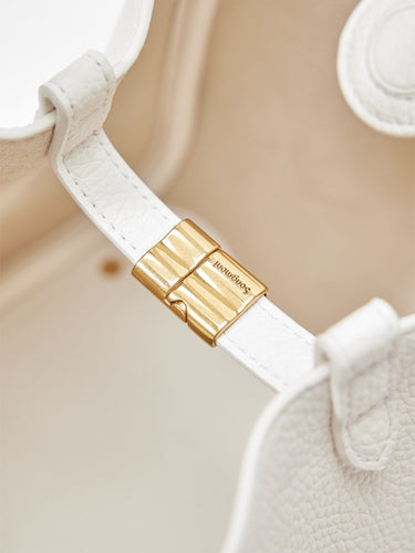 Medium Song Bag in Eco Cloud vegan leather with gold hardware closure featuring embossed Songmont logo.