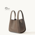 Medium Song Bag in Eco Taupe vegan leather with Global Recycled Standard certification.