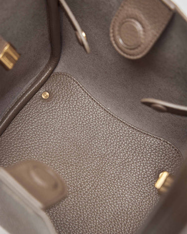 Interior of the Medium Song Bag in Eco Taupe vegan leather, showing textured lining and inner pouch.