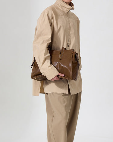 Medium Yore Duffle Bag in Sandal color, made from vegetable-tanned leather with stainless steel hardware.