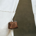 Medium Yore Duffle Bag in Sandal color, made from vegetable-tanned leather, perfect for travel and everyday use.
