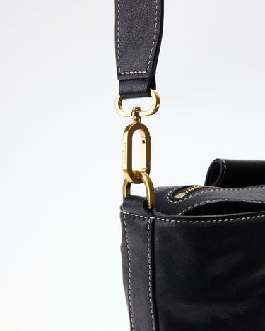 Black Yore Duffle Bag with gold 'Songmont' clasp and white stitching