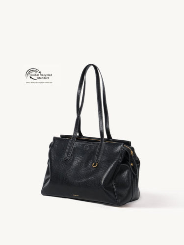 Medium Yore Duffle Bag in Onyx - vegan leather travel bag with GRS certification.