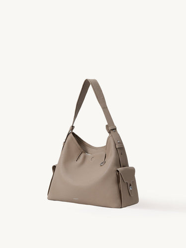 Medium Yore Hobo Bag in Cobble Grain textured leather with silver hardware and adjustable strap.