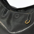 Medium Yore Hobo Bag in Onyx with textured leather, white stitching, and gold hardware detail.