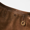 Medium Yore Hobo Bag in Sandal Suede, crafted from cow suede leather with white stitching and gold hardware.