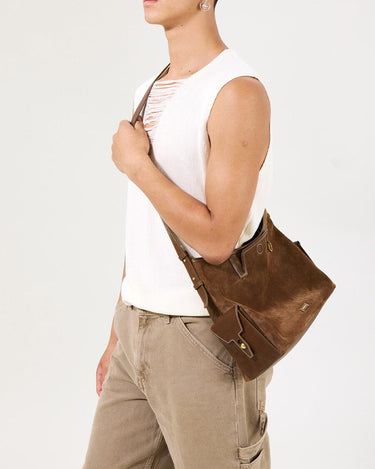 Medium Yore Hobo Bag in Sandal Suede with leather accents, worn by a model.