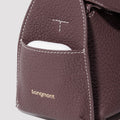 Burgundy Mini Drippy Roof Bag with exterior pocket and gold Songmont logo.