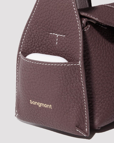 Burgundy Mini Drippy Roof Bag with exterior pocket and gold Songmont logo.
