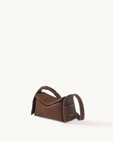 Mini Drippy Roof Bag in chocolate brown textured leather with white stitching and top handle.