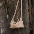 Mini Drippy Roof Bag in cobble textured leather, showcasing its structured yet soft design and gold hardware accents.