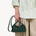 Mini Drippy Roof Bag in Emerald green textured leather with architectural design and gold feet.