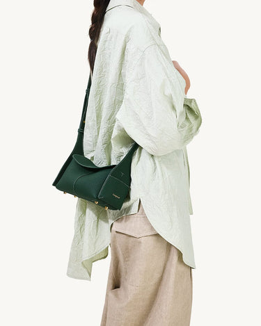 Emerald Mini Drippy Roof Bag crafted from textured leather, featuring a structured silhouette and subtle gold hardware.