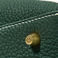 Mini Drippy Roof Bag in Emerald green full-grain leather with embossed Songmont logo stud and stitching.