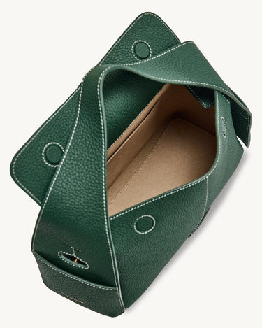 Emerald green Mini Drippy Roof Bag in textured leather with white stitching, showing open interior and flap closure.