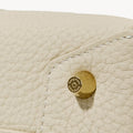 Ivory Mini Drippy Roof Bag close-up: textured leather, stitching, and engraved songmont logo hardware.