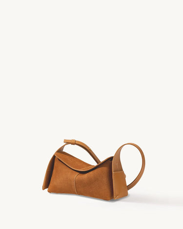Mini Drippy Roof Bag in Sea Buckthorn nubuck leather, featuring a unique architectural design and adjustable strap.