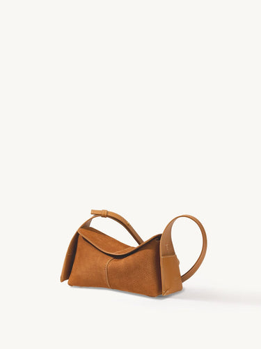 Mini Drippy Roof Bag in Sea Buckthorn nubuck leather, featuring a unique architectural design and adjustable strap.