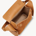 Mini Drippy Roof Bag in Sea Buckthorn nubuck leather with visible stitching. Open top shows suede interior.