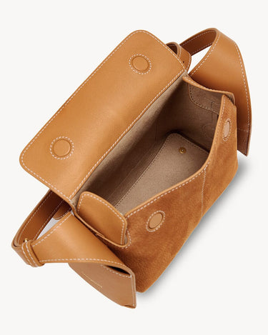 Mini Drippy Roof Bag in Sea Buckthorn nubuck leather with visible stitching. Open top shows suede interior.