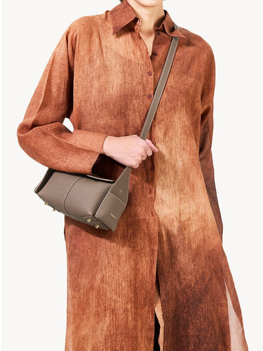 Taupe Mini Drippy Roof Bag: textured leather, gold hardware, unique architectural design.