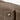 Taupe Mini Drippy Roof Bag crafted from full-grain leather with white stitching and a gold hardware detail.