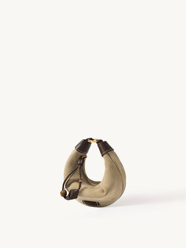 Mini Luna Airpods case in cow suede leather with full-grain leather details and gold hardware.