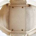 Interior view of ivory Mini Song Bag, full-grain leather lining, structured base with metal feet.