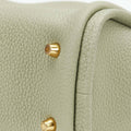 Light sage green full-grain leather Mini Song Bag with gold hardware feet