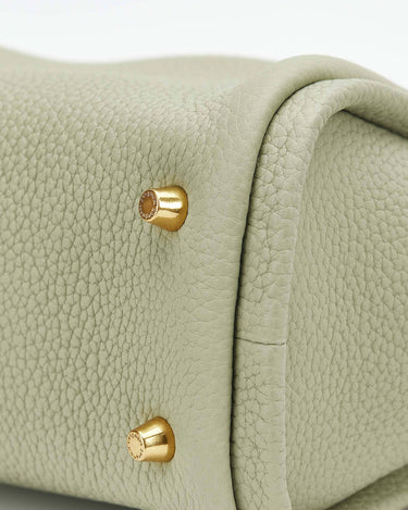 Light sage green full-grain leather Mini Song Bag with gold hardware feet