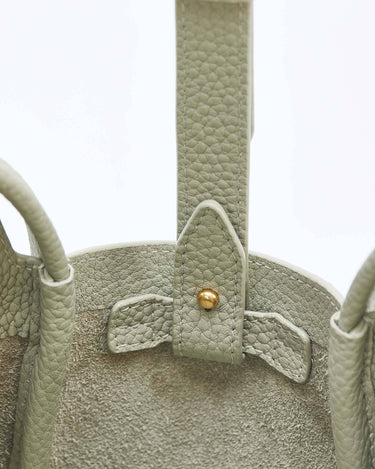 Jade green Mini Song Bag, textured leather, gold stud closure, compact design for spring/summer.