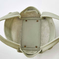Interior of the Jade Mini Song Bag, showing pebbled leather and suede lining.