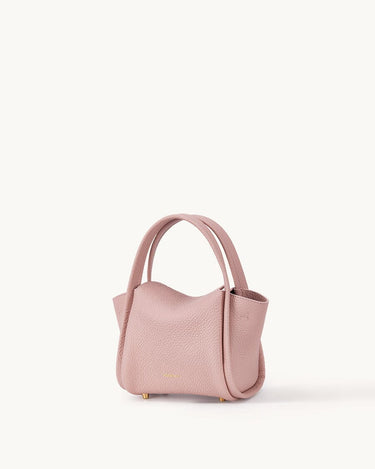 Pink Mini Song Bag made of full-grain leather with gold hardware and adjustable strap