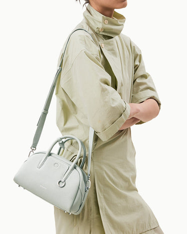 Mini Yore Bowling Bag in Celeste full-grain leather with silver hardware and adjustable strap.