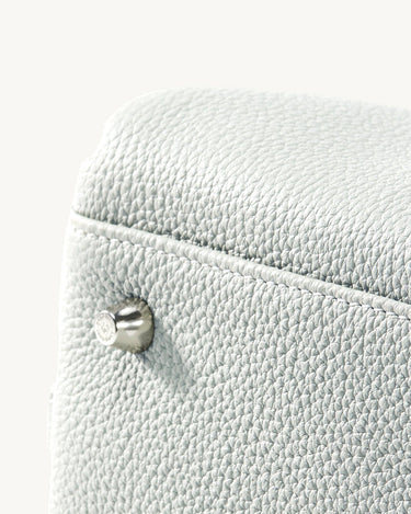 Mini Yore Bowling Bag in Celeste: Textured full-grain leather with silver hardware clasp.