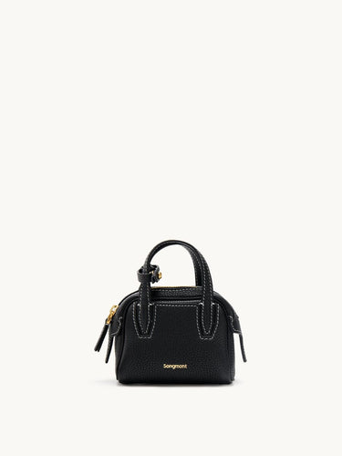 Mini Yore black full-grain leather bowling case with white stitching and gold hardware.
