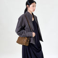 Mini Yore Duffle Bag in Sandal color, made from vegetable-tanned leather with stainless steel hardware.