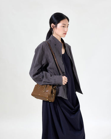 Mini Yore Duffle Bag in Sandal color, made from vegetable-tanned leather with stainless steel hardware.